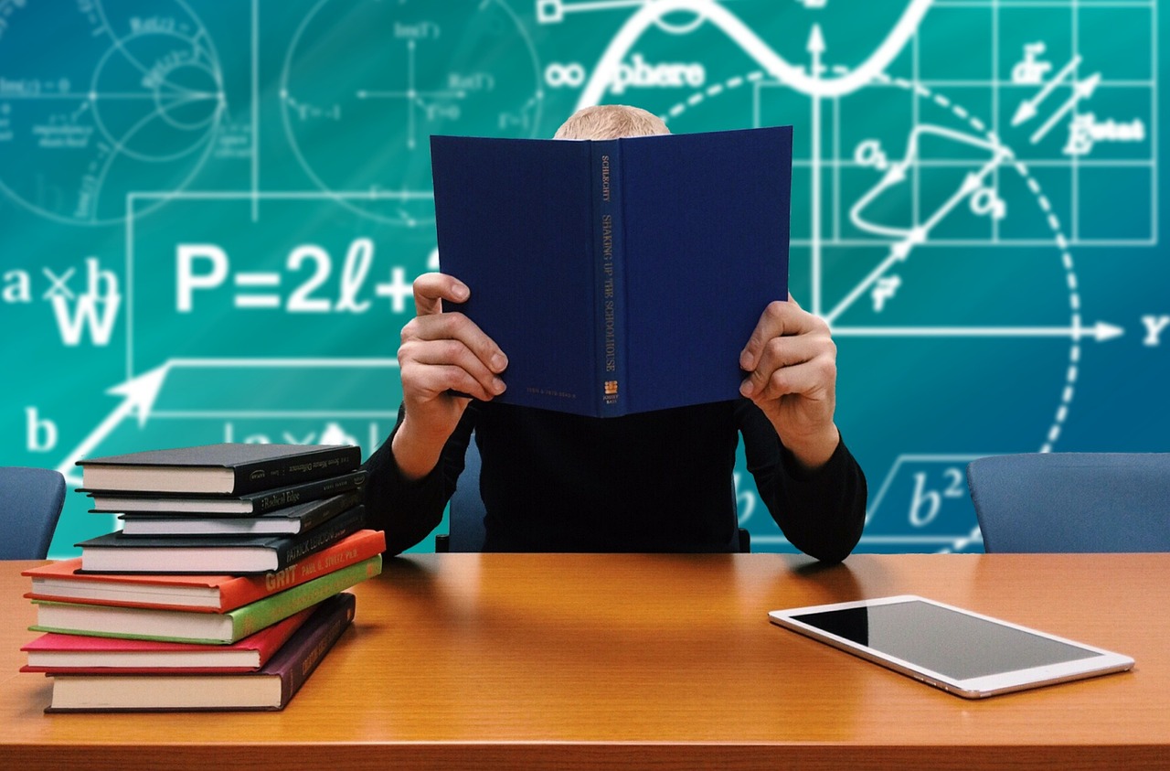 Happy student learning with tutor in 